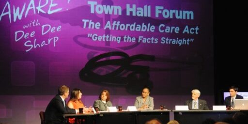 Panel discussion on the Affordable Care Act at a town hall event.