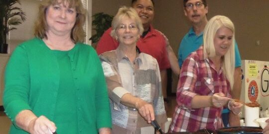 Picture of PSC staff member serving chili.