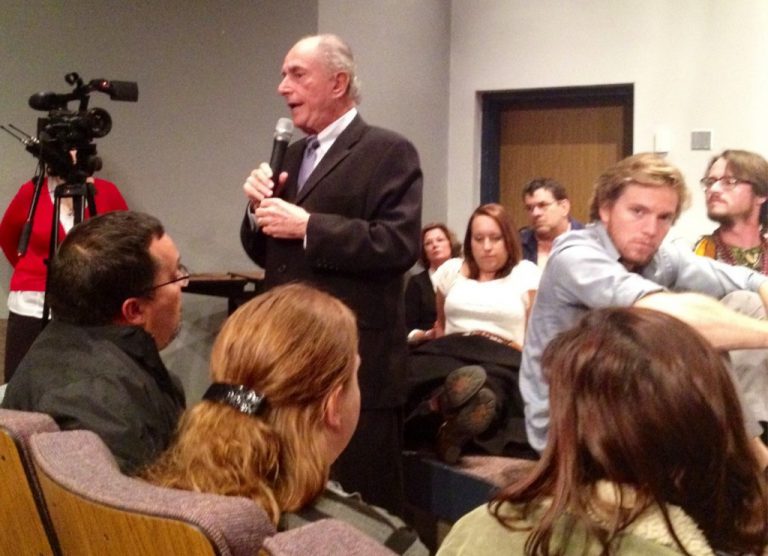 College speaker addressing students at eCorsair event.