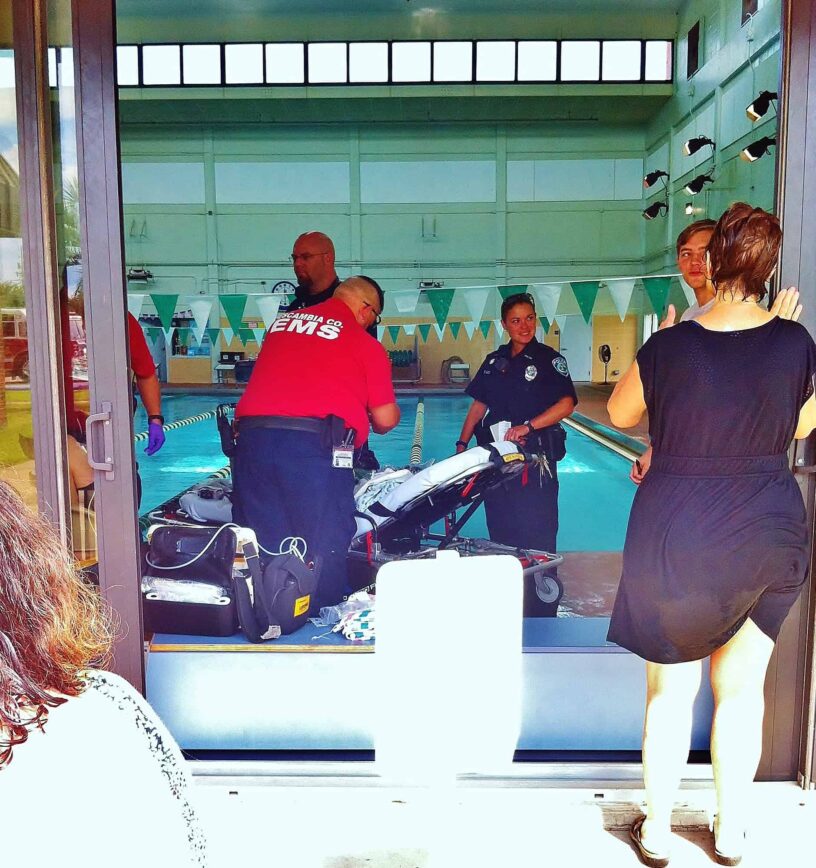 Emergency response at PSC swimming pool during a seizure incident. Emergency responders assist a person experiencing a seizure at the PSC swimming pool.