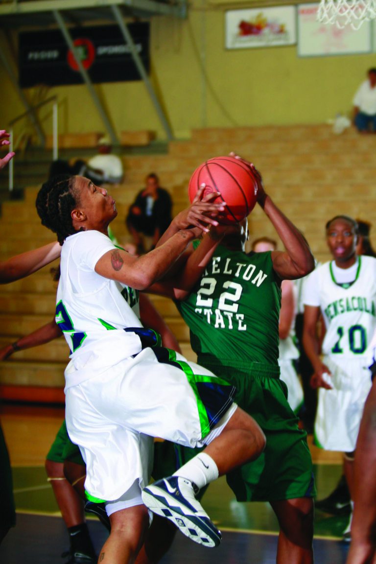 Female basketball players in action during a game at eCorsair.
