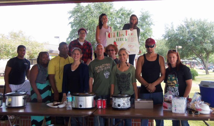 Group of students and staff at eCorsair chili fundraiser event.