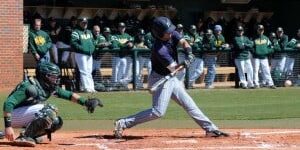 Delgado baseball player swinging at a pitch during a game against pirates.