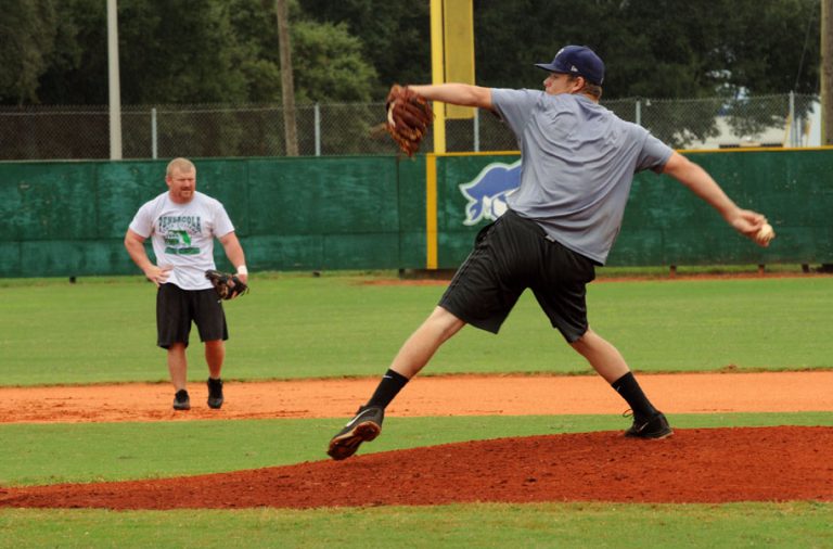 PSC alumni playing baseball at the eCorsair alumni game event.