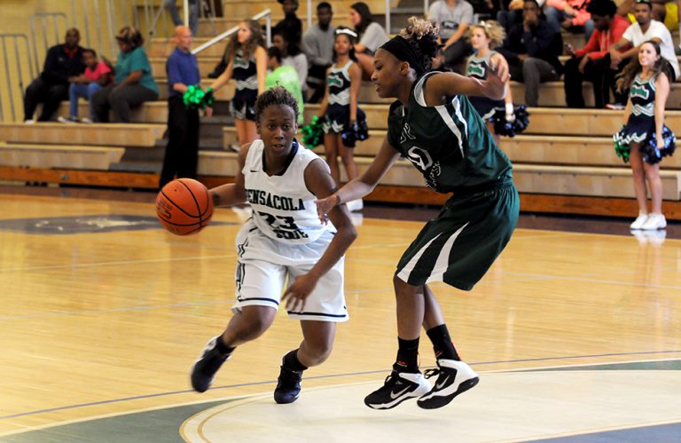 PSC women's basketball player dribbling during a game at the classic tournament.