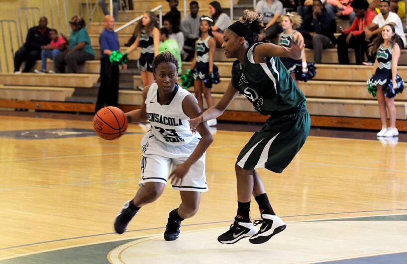 PSC women's basketball player dribbling during a game at the classic tournament.