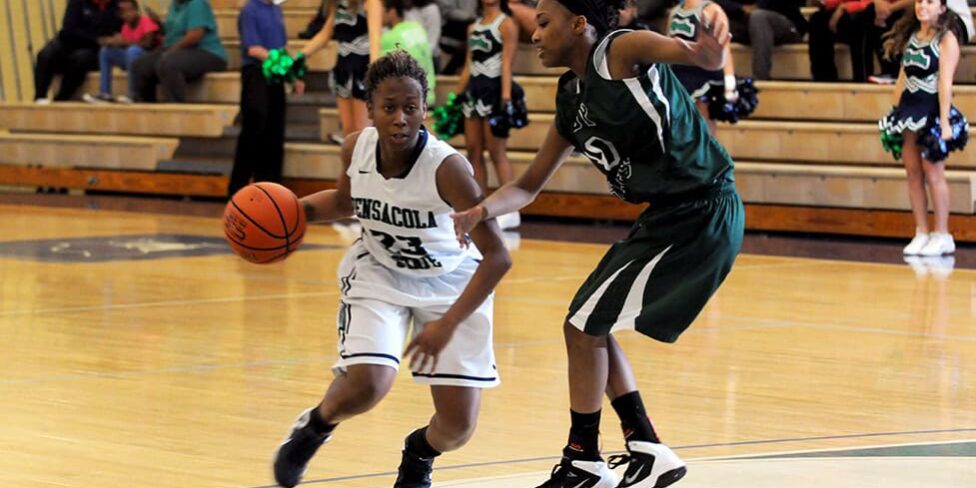 PSC women's basketball player dribbling during a game at the classic tournament.