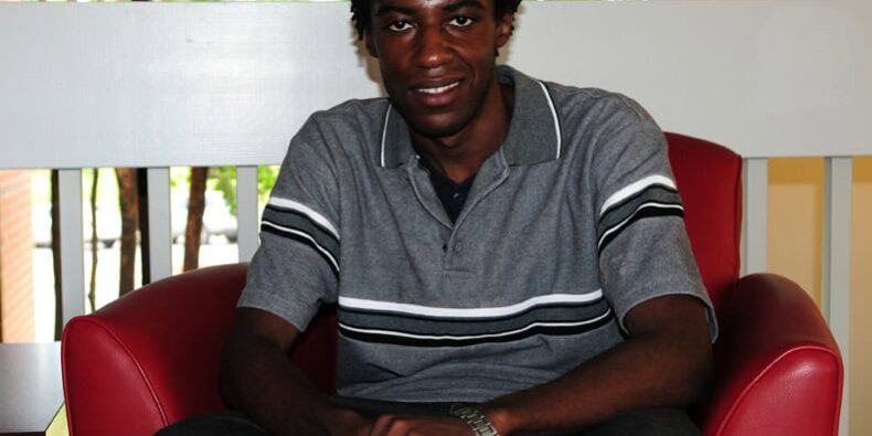 Selfish Souls – eCorsair Student Portrait Student sitting confidently in a red chair at eCorsair, Pensacola State College.