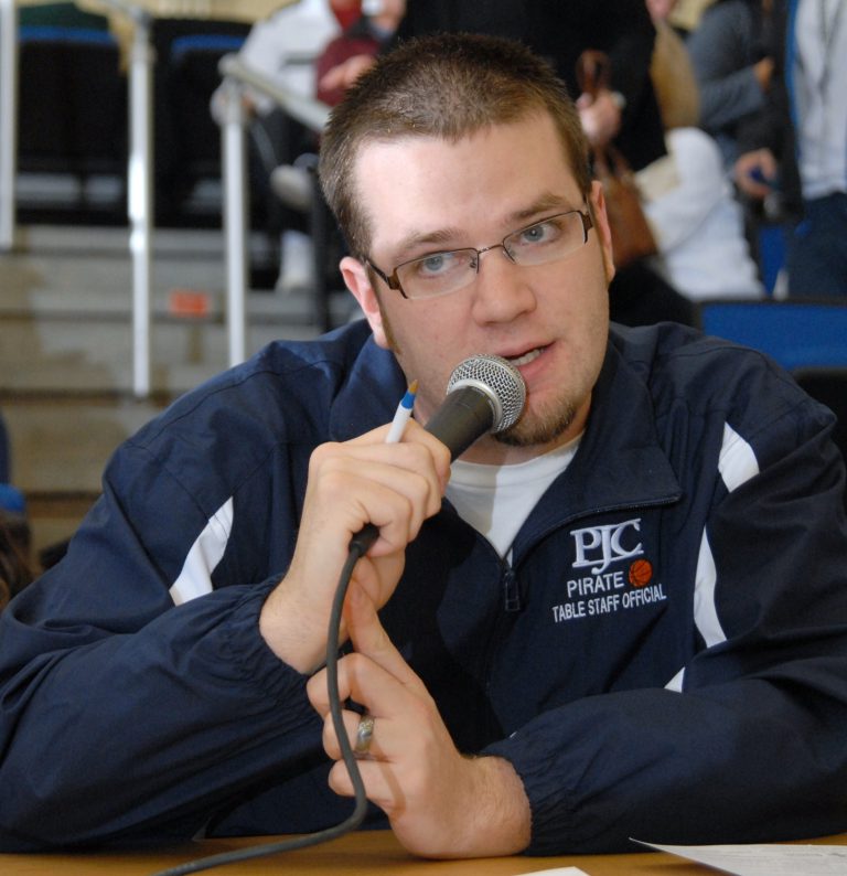 Student speaking into microphone at PJC event, representing the PJC Microphone program.