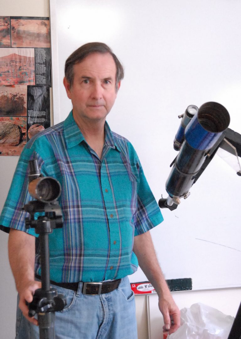 Ecorsair student practicing with telescope equipment.