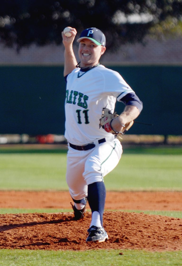 Baseball player in Pirates uniform celebrating on the mound after a home run.