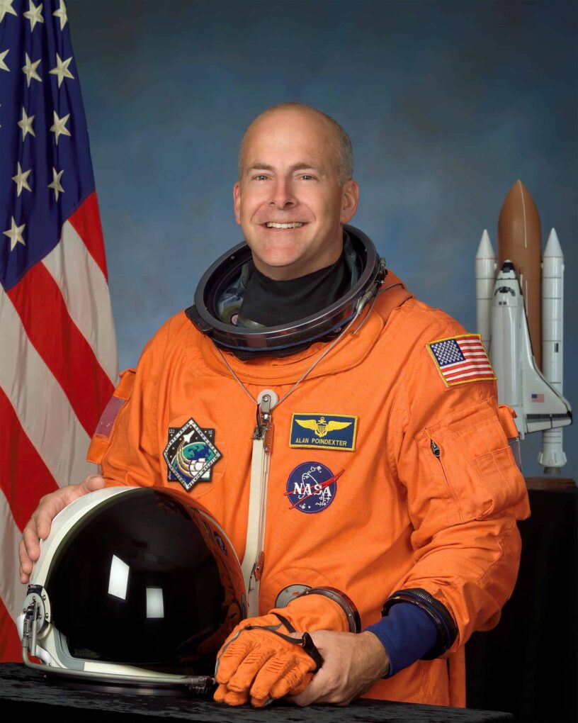 NASA Astronaut Alan Poindexter in Space Suit NASA astronaut Alan Poindexter in space suit with NASA and space shuttle patches.