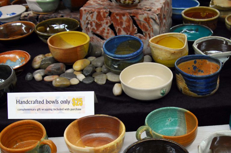Handmade pottery bowls for charity at Pick-a-bowl event supporting Manna Food Bank.