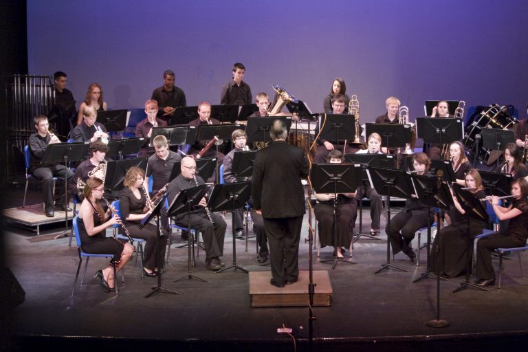 PJC Wind and Jazz Ensemble playing on stage during a concert.