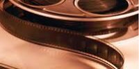 Classic film reel representing movie reviews related to Ender's Game.