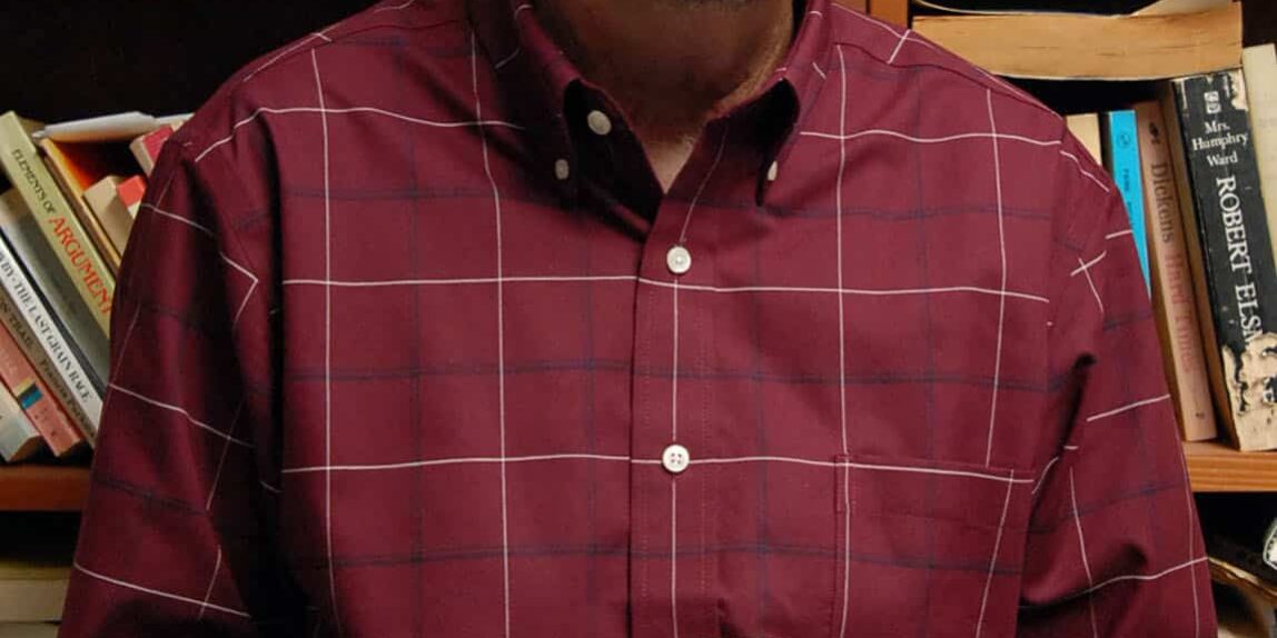 Exploring the Plank at eCorsair Man standing on a plank in a library setting at eCorsair, Pensacola State College.