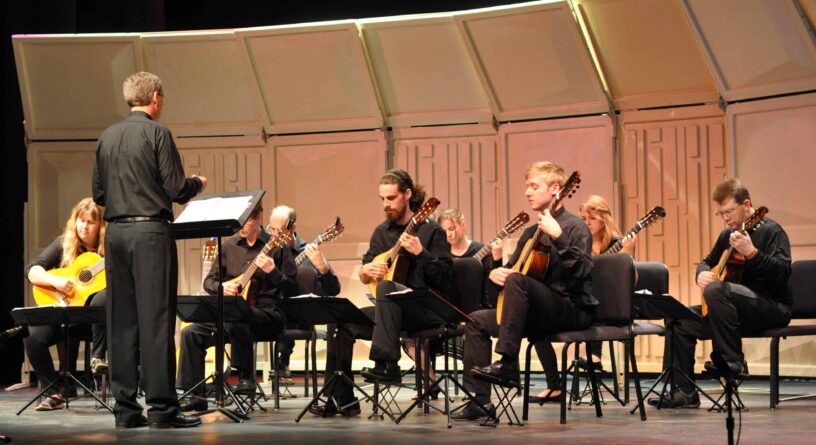 Classical Guitar Orchestra Spring Recital Classical guitar orchestra performing at spring recital event.
