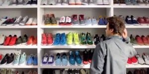 Student browsing colorful sneaker collection at eCorsair, PSC campus.