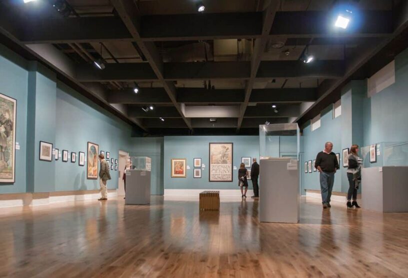 Pensacola Museum of Art – eCorsair exhibit Visitors viewing the Mucha art exhibit at Pensacola Museum of Art.
