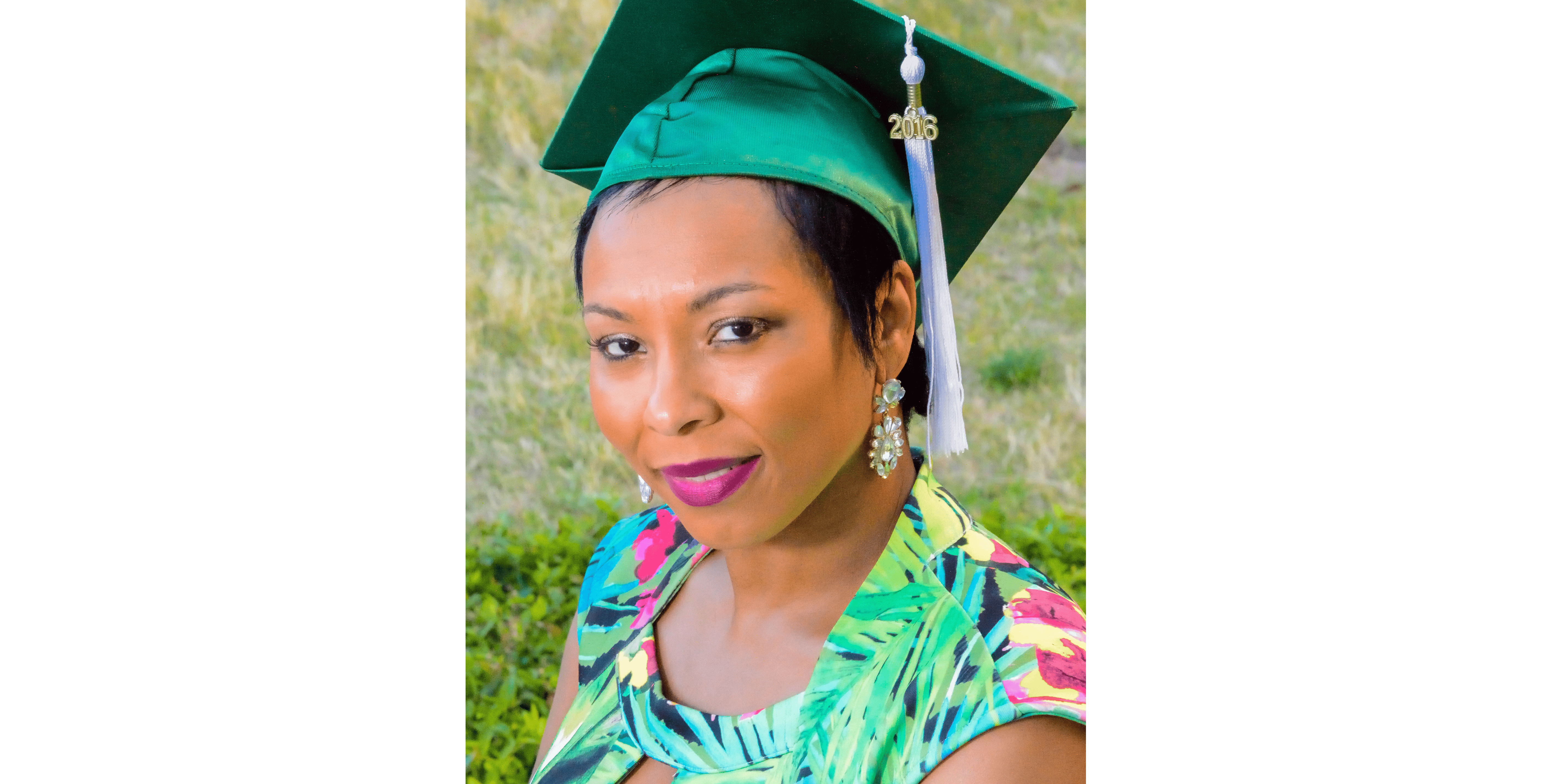 Graduation Cap and Gown Woman in graduation cap celebrating GED achievement outdoors.