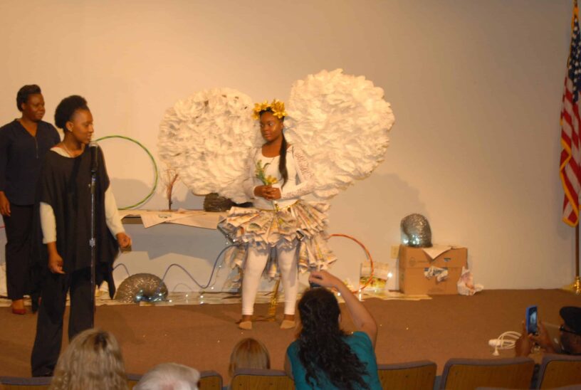 Cosmetology students showcase eco-friendly recyclable fashion on runway.