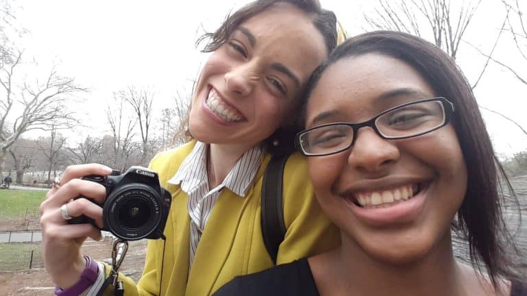 Student capturing photos during college event at Pensacola State College.