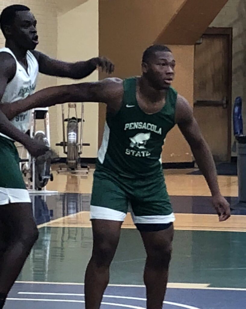 Men’s basketball player in action during game at Pensacola State College.