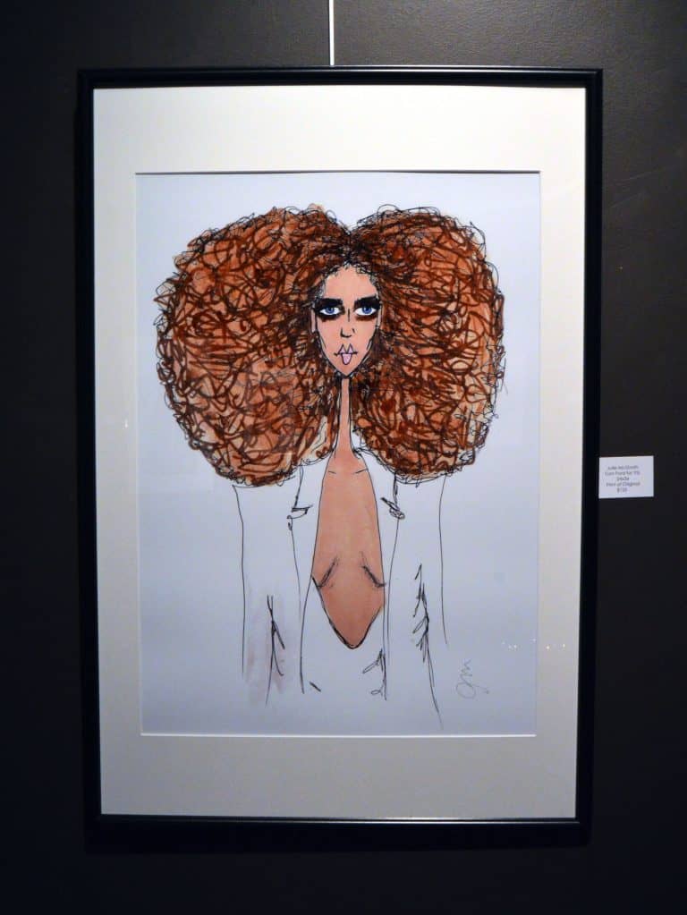 Vibrant portrait of a woman with voluminous curly hair and bold makeup, displayed at Artel Gallery.