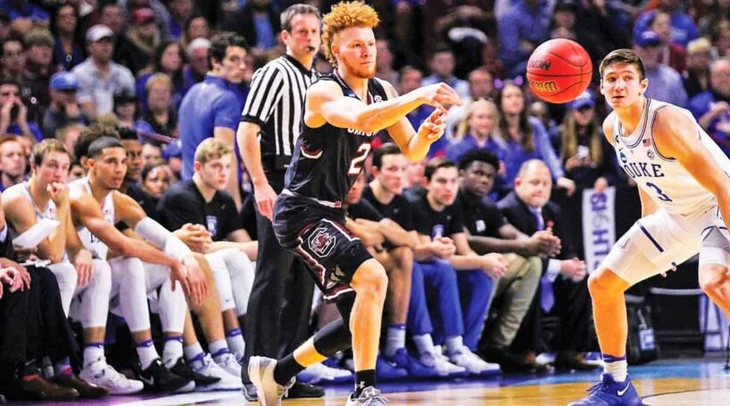 College basketball game with eCorsair player passing the ball during Final Four.