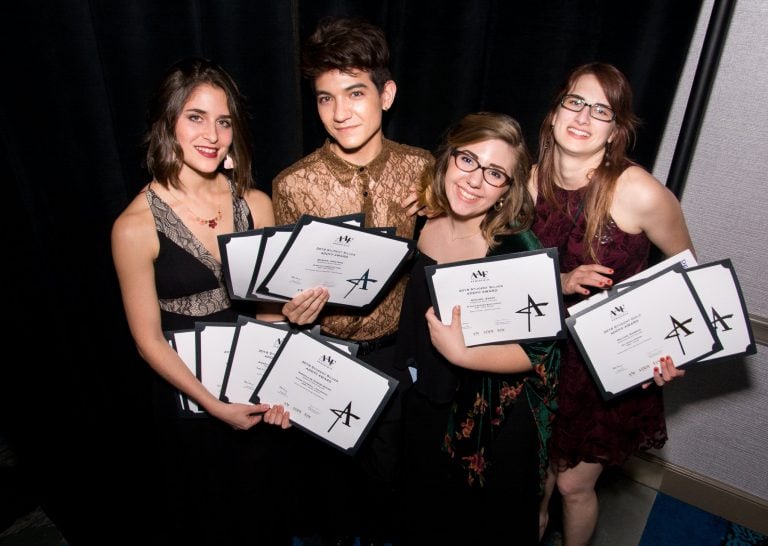 Group of Visual Arts students holding ADDY award certificates at Pensacola State College.
