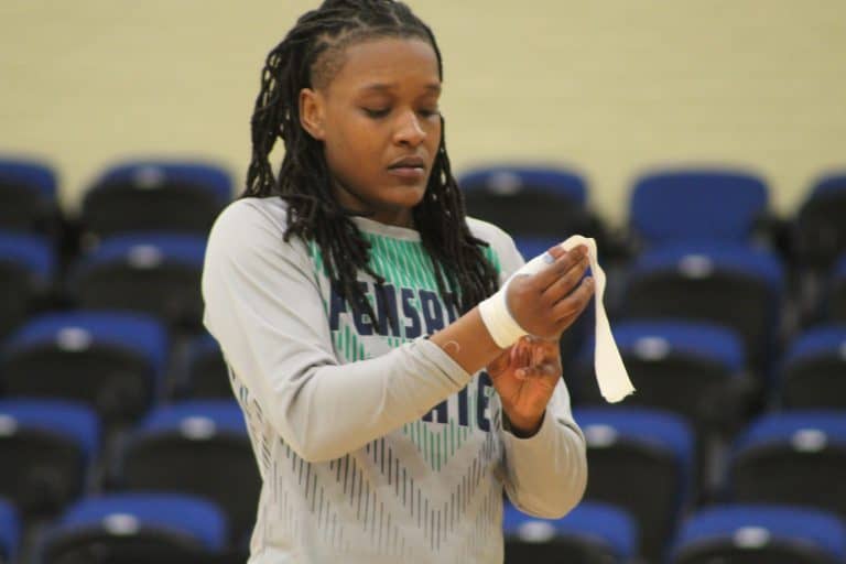 Willesley Butler, volleyball player, preparing for match at Barrons Corner.