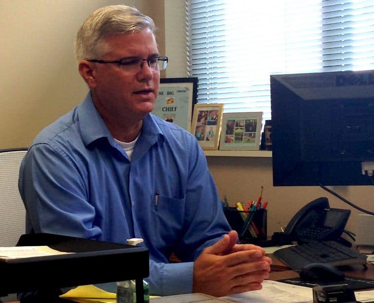 Student reviewing campus safety protocols at eCorsair on Pensacola State College campus.