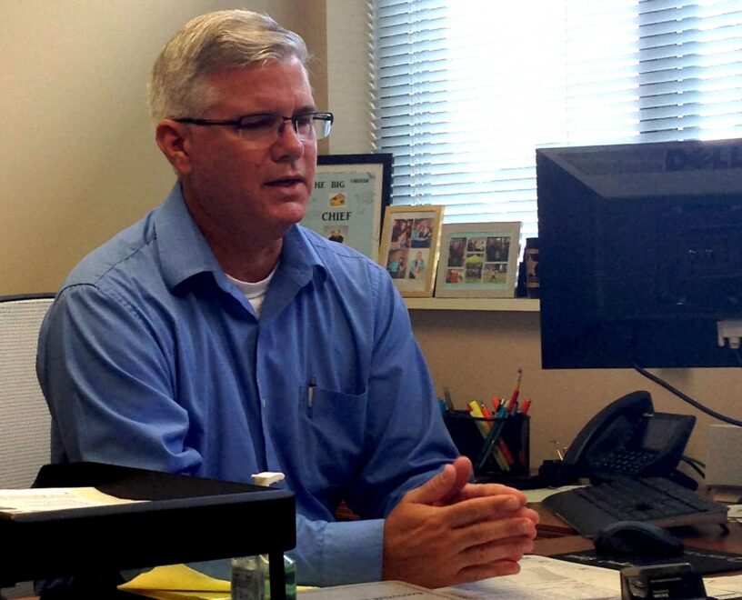 Student reviewing campus safety protocols at eCorsair on Pensacola State College campus.