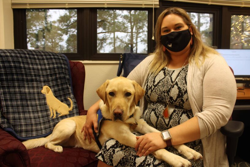 Dog-tor Rudy at PSC event Dog-tor Rudy with student at PSC event.