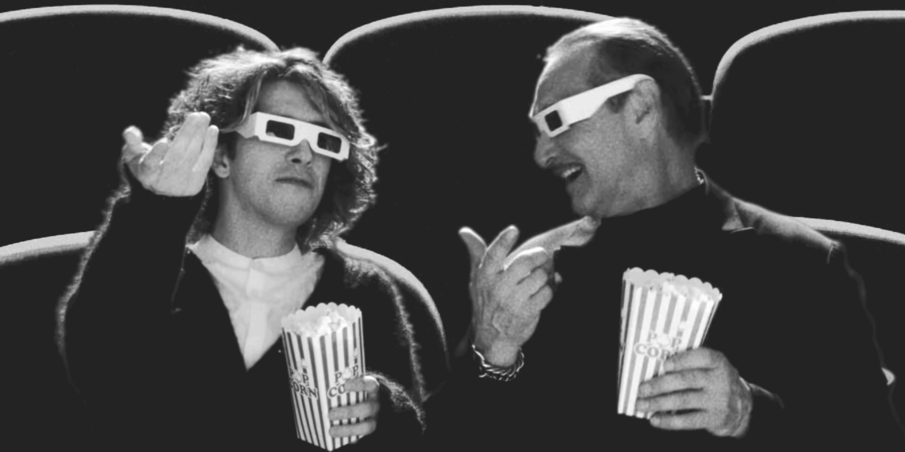 Two people enjoying a movie with 3D glasses and popcorn at eCorsair event.