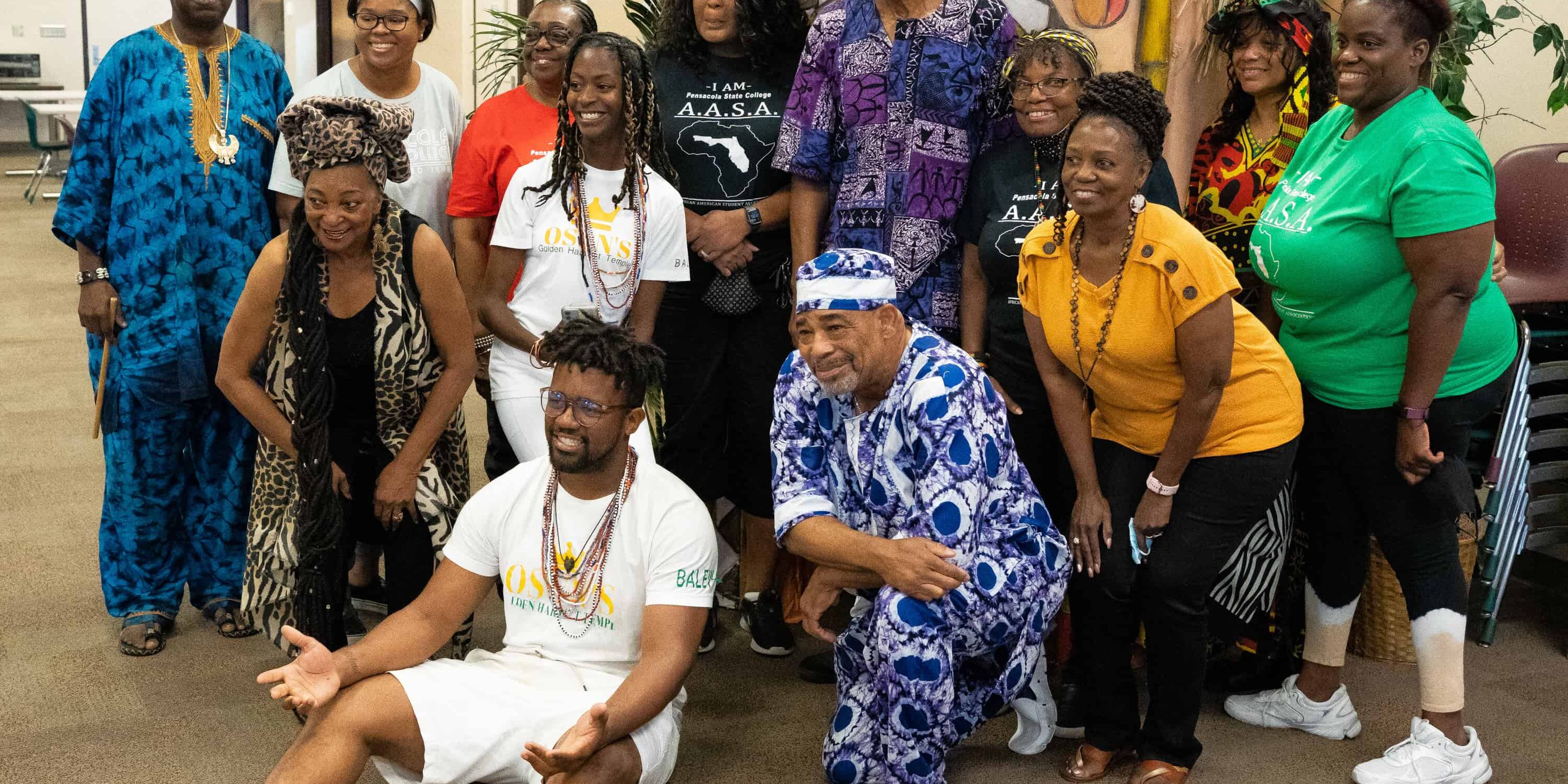 Group of diverse students and staff celebrating at eCorsair event.