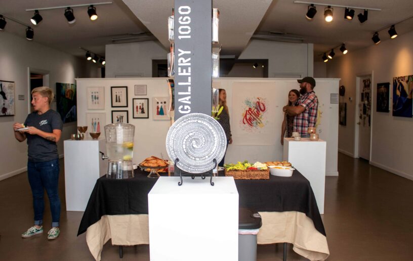 Art Gallery Exhibition at eCorsair, Pensacola State College. Art gallery, exhibition, Pensacola State, students, artwork display, cultural event.