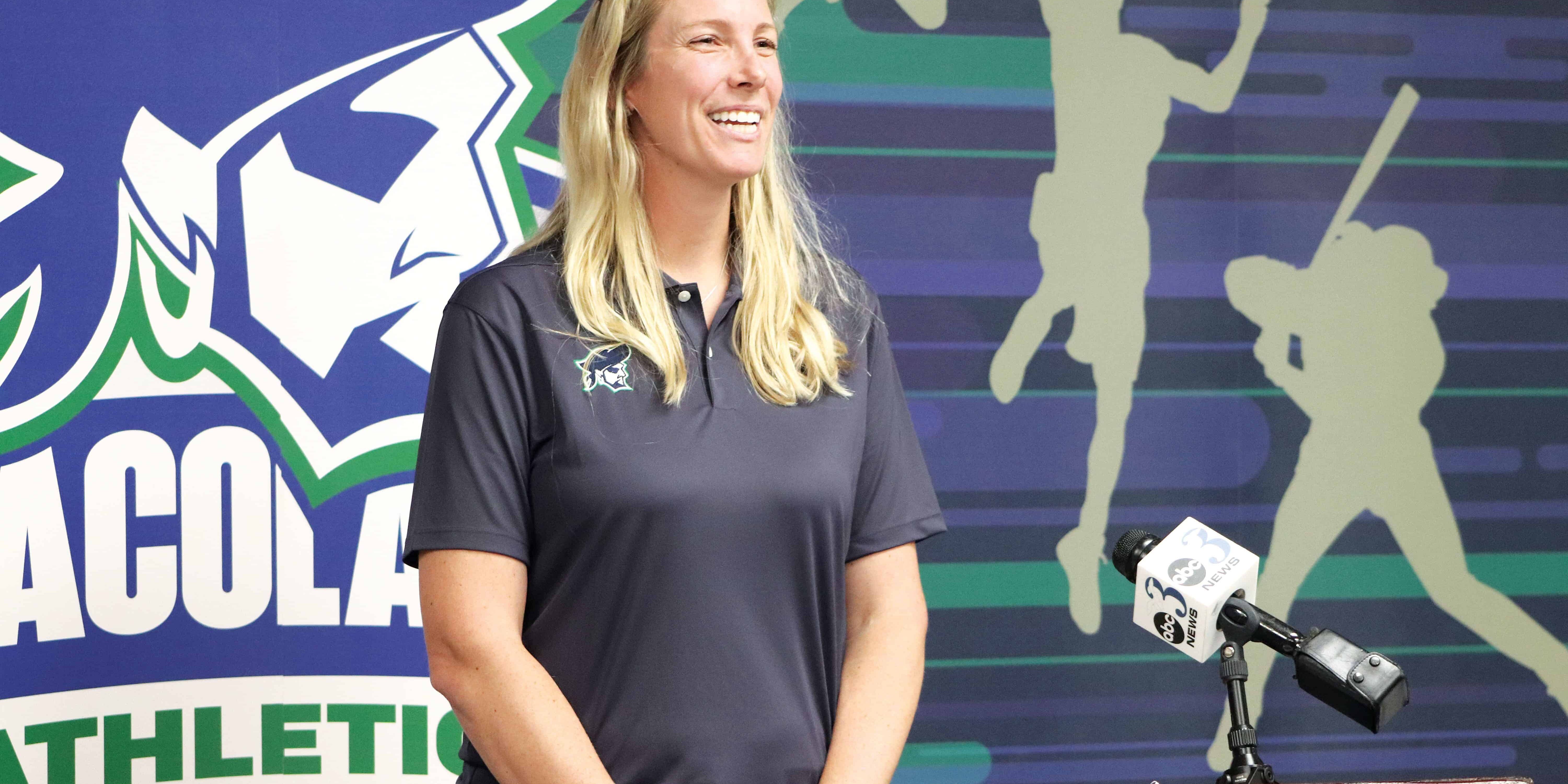 ECorsair athletic program logo with a smiling female athlete at a podium.