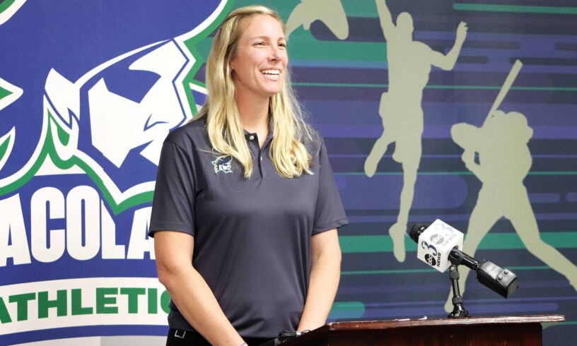 ECorsair Logo and Athlete ECorsair athletic program logo with a smiling female athlete at a podium.