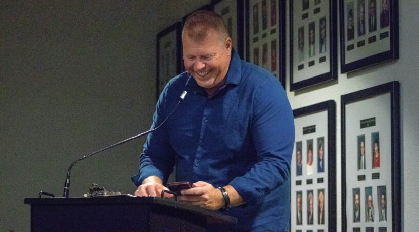 eCorsair Student at Pensacola State College Student smiling at podium during eCorsair event at Pensacola State College.