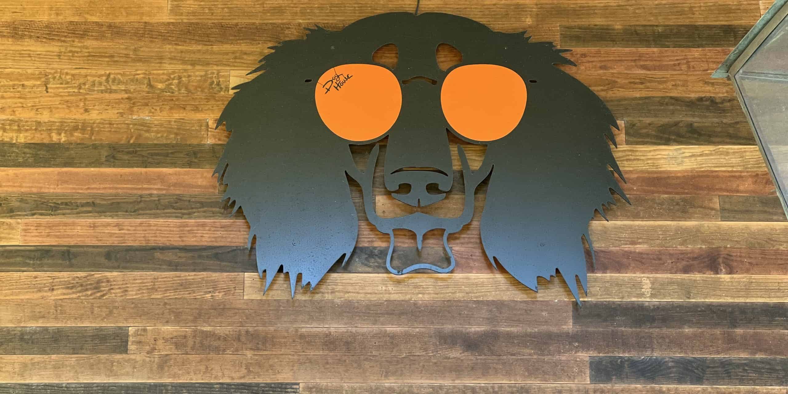 Decorative lion head sign for Heir of The Dog at eCorsair, Pensacola State College.