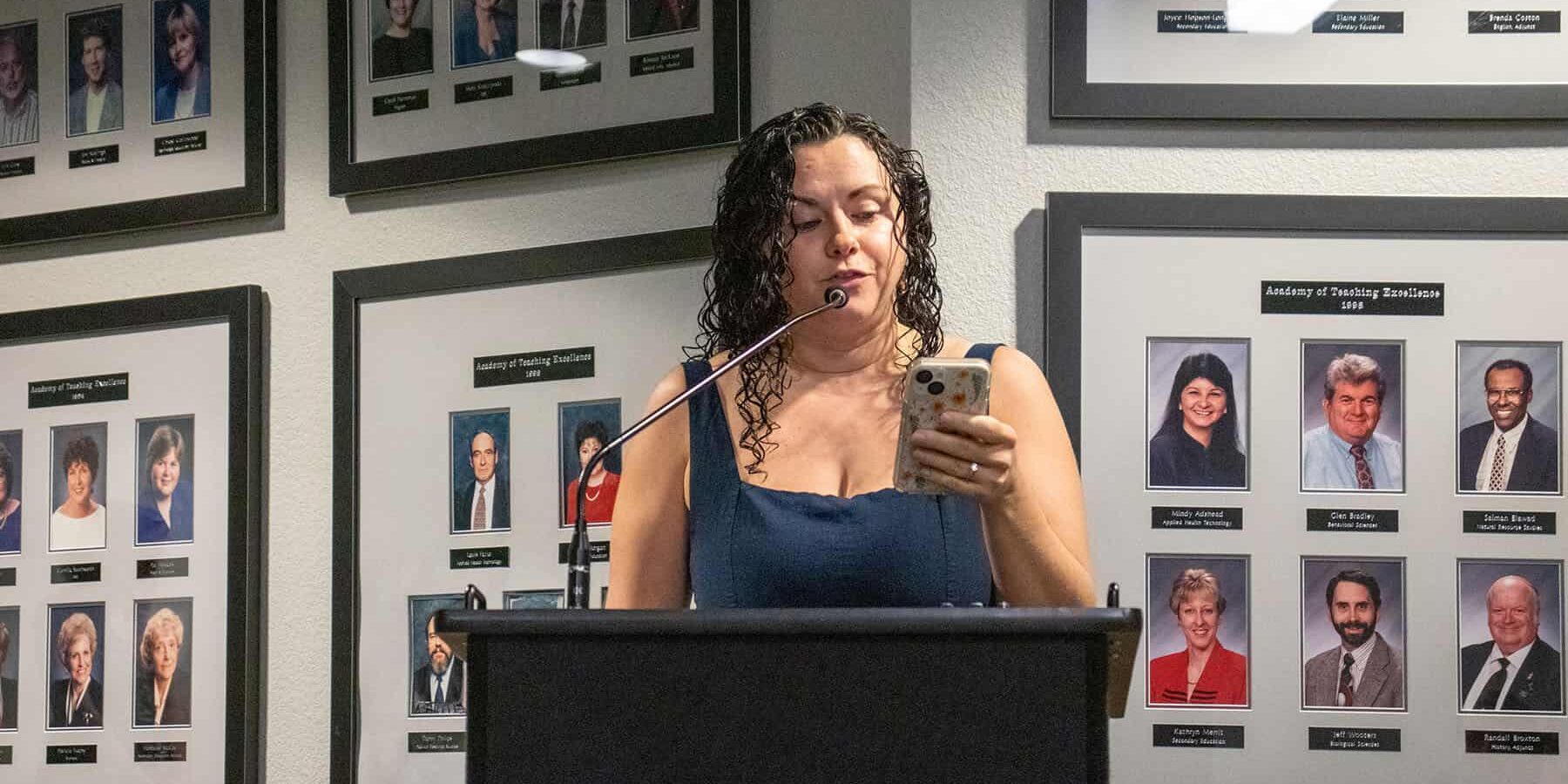 Student speaking at podium during eCorsair event at Pensacola State College.