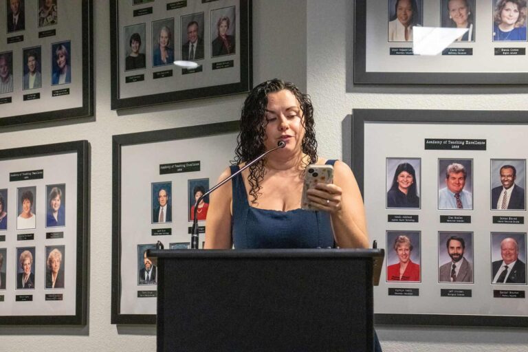 Student speaking at podium during eCorsair event at Pensacola State College.