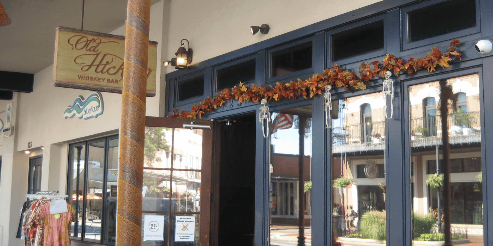 Old Hickory Whiskey Bar Cozy whiskey bar decorated for fall with autumn leaves and warm lighting.