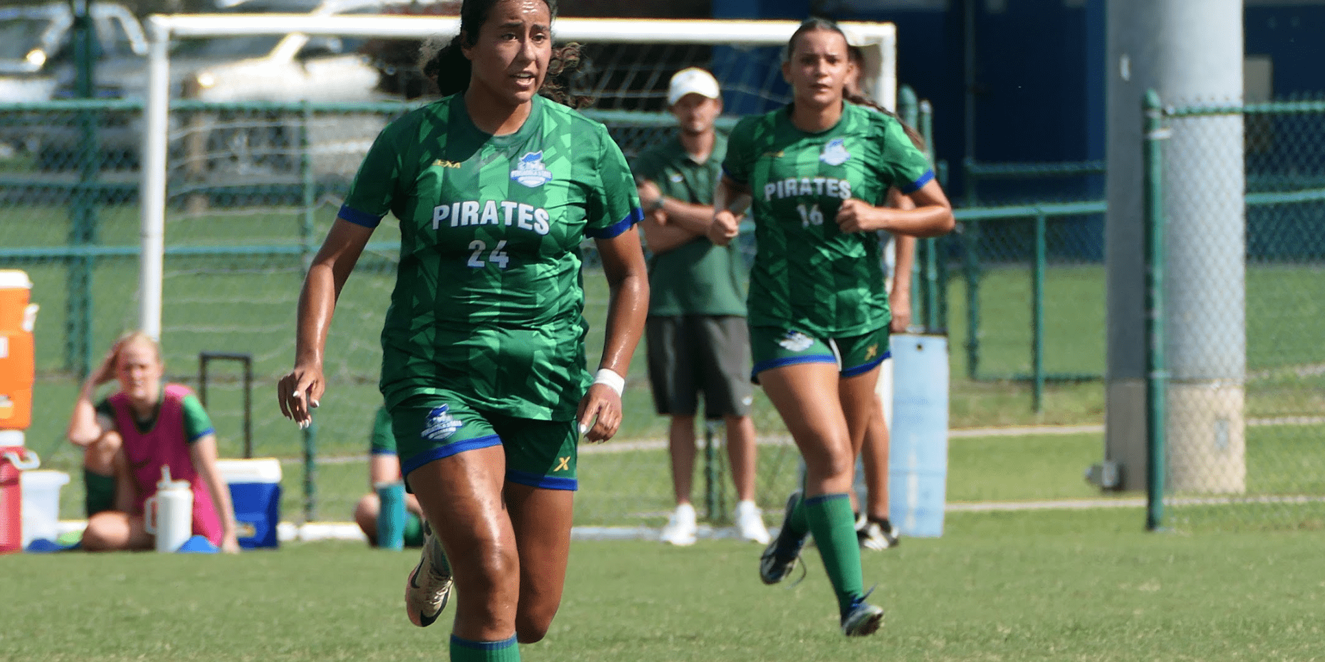 Women’s soccer team at Pensacola State College playing on the field.