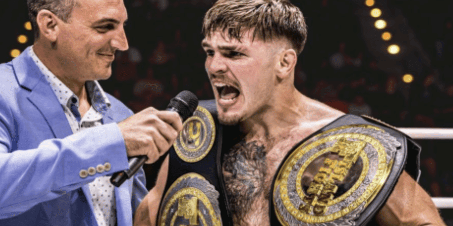 Island Fights Championship at Pensacola event. Boxer with championship belts being interviewed after victory.