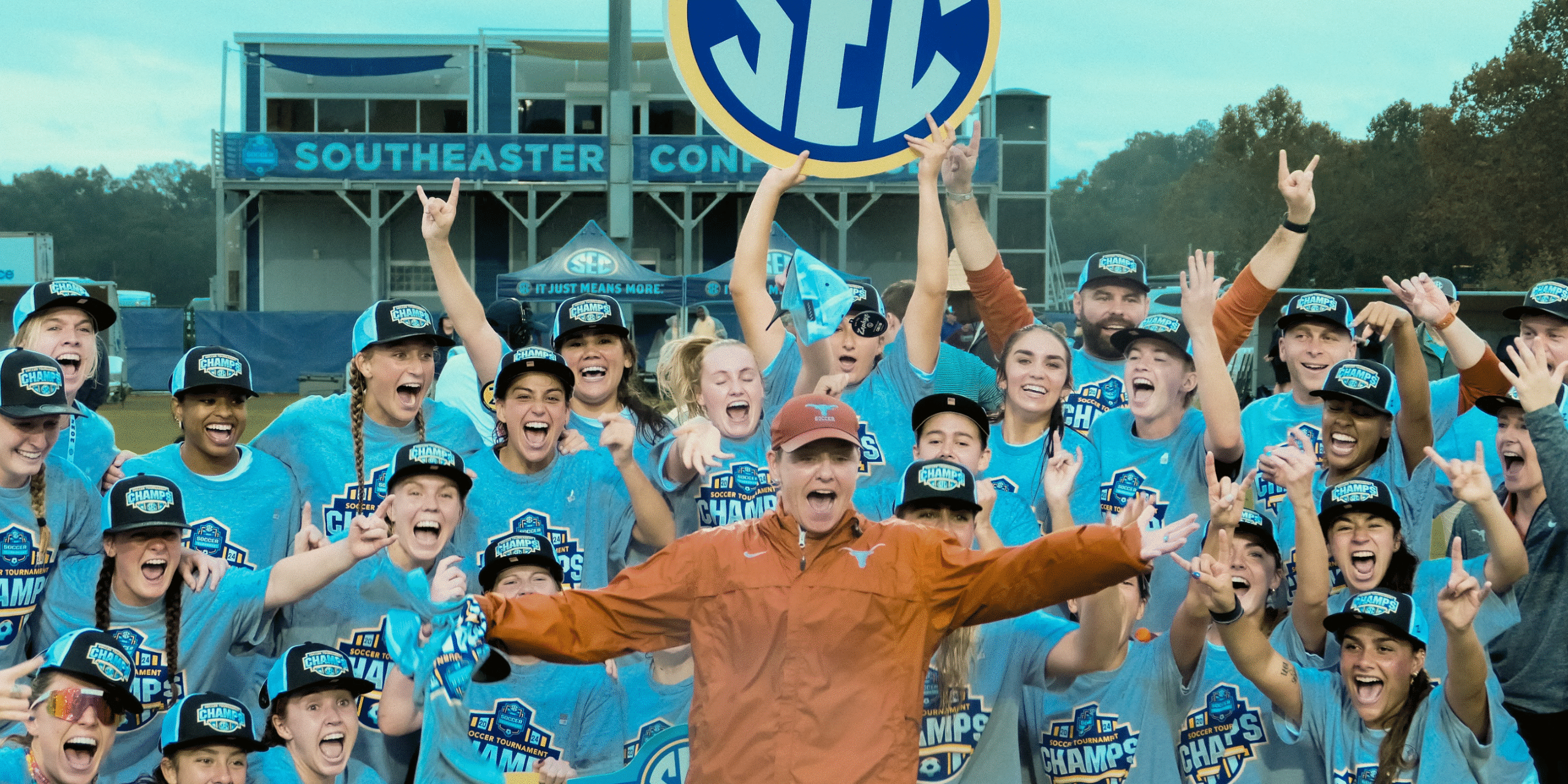 Cheerleaders celebrating SEC victory at Sun-Lakes Conference event.