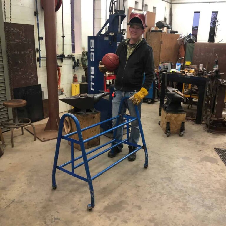 Artist working on steel frame sculpture in workshop for Pensacola Museum of Art exhibit.