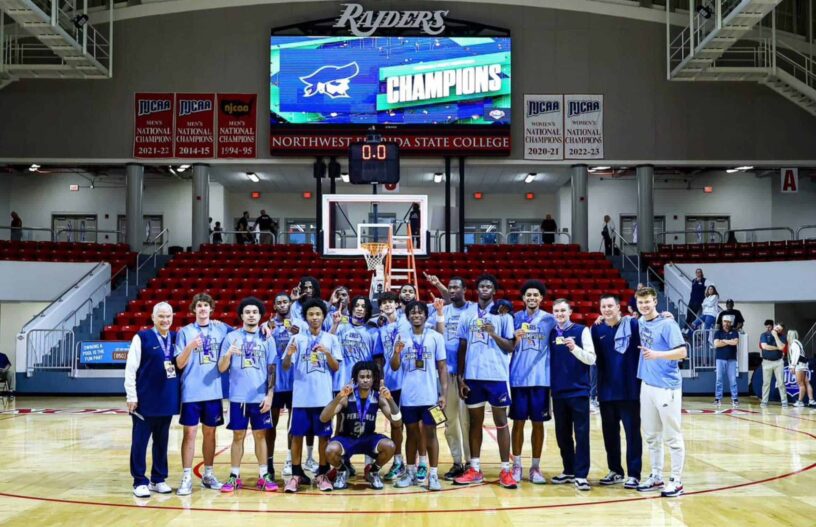 ECorsair basketball team celebrating their state championship victory.