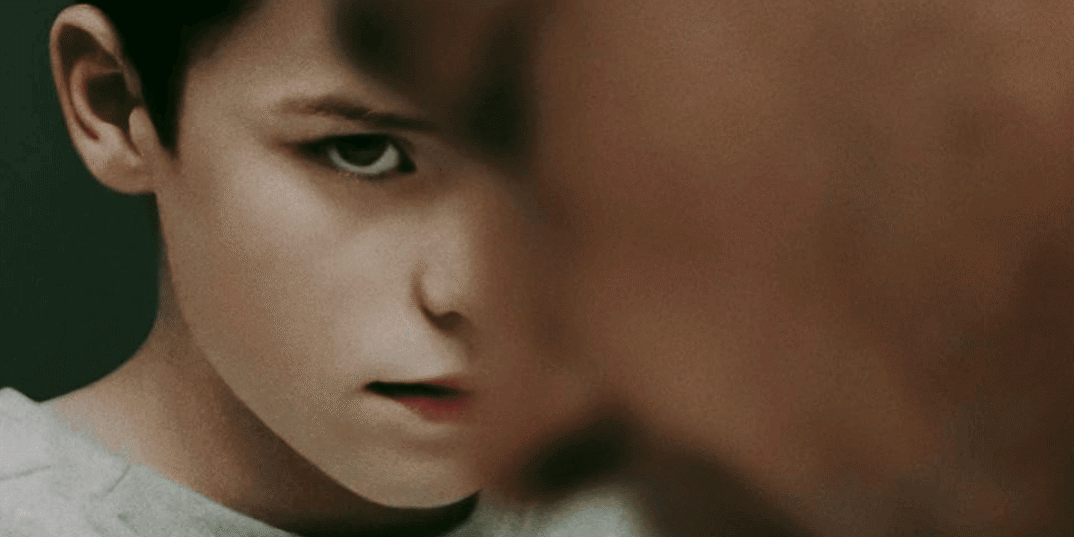 Child facing an adult in a tense moment, highlighting themes of adolescence and emotional struggles.